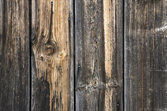 Old weathered wooden boards on wooden wall