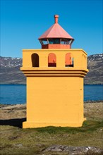 Orange lighthousehouse