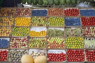 Roadside stand selling organic fruits exposed on armenian newspaper