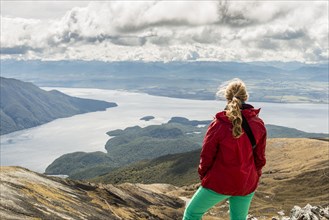 Female hiker looking at the South Fiord of Lake Te Anau