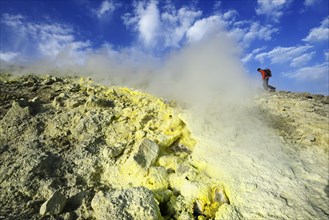Hiker on the Gran Cratere walks through sulphur fumaroles