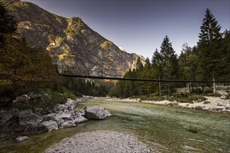 Bridge over Isonzio river in autumn mood in Triglav National Park