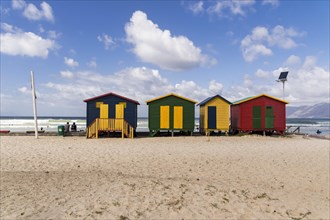 Colorful beach houses with cloudy sky