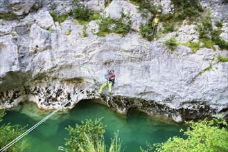 Man crossing the Verdon river on a rope