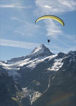 Paraglider flying in the sky