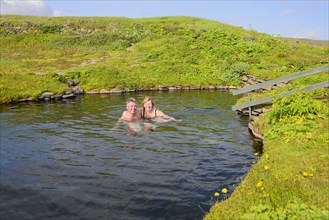 Tourists bathing in spring
