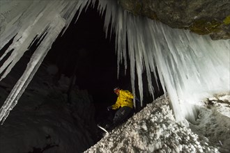 Snowboader in ice cave