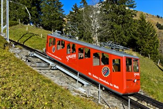 Red car of the Pilatusbahn on the ascent to Mount Pilatus