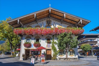 Flower decoration at the entrance of a confectionery cafe in Oberaudorf