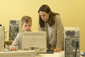 Elementary school student working in computer room