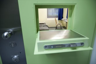 Looking through hatch in jail cell