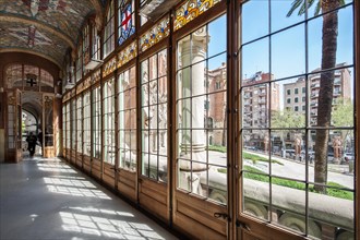 Glass hallway with tiled ceiling in the historic hospital complex Hospital de Sant Pau