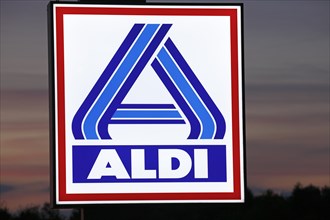 Illuminated company logo sign of the food discounter ALDI Nord