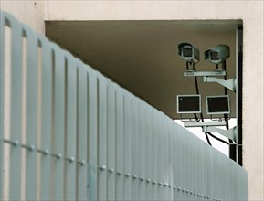 Surveillance camera on security fence