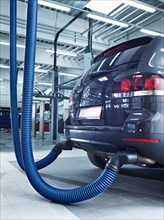 Exhaust emission measurement on car in a VW garage