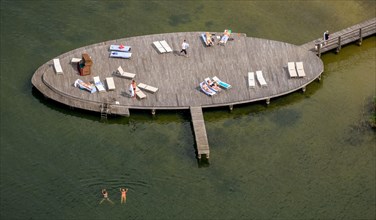 Aerial view of bathing jetty with sunbeds and bathers