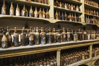 Showroom with old dust covered sherry bottles