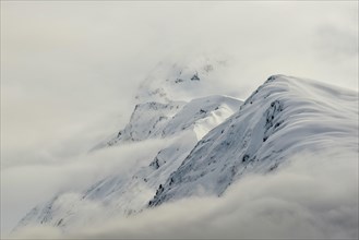 Mountains with snow and clouds