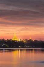Illuminated Shwedagon Pagoda at sunset