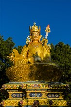 Big golden statue of Padmasambhava at back of Swayambhunath temple