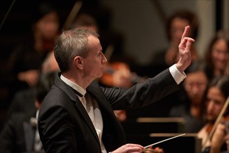 Conductor Garry Walker conducts the State Orchestra