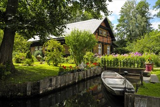 Spreewald house with boat on Fliess river