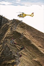 Mountain rescue by helicopter on the Fellhorn ridge