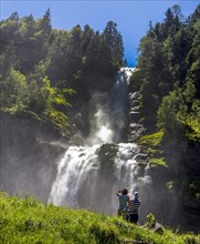 Two women in front of Rouget waterfall