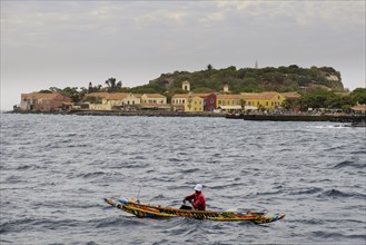 Fishermen in a traditional canoe on the Isle de Goree