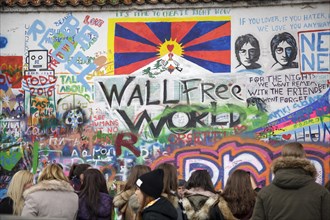 People visiting John Lennon Wall