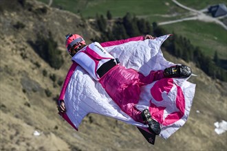 Base jumper flying with wingsuit in the air