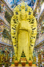 Giant golden standing Buddha