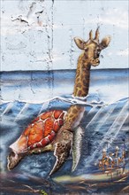 Giraffe swimming in the sea