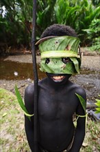 Korafe-child with facial and headdress made of leaves
