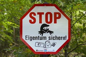 Warning sign for thieves in the forest area of Ahrenshoop