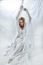 Redhead maiden woman in white cloth
