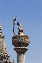Statue of King Yoganarendra Malla with snake and bird