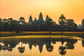 Temple complex of Angkor Wat reflected in the water basin