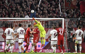 Goalkeeper Fabian Bredlow 1st FC Nuremberg FCN fists ball after corner ball ahead of Thomas Muller FC Bayern Munich