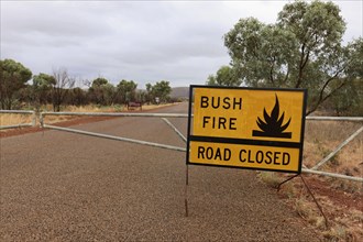 Street sign for road closure due to bush fire