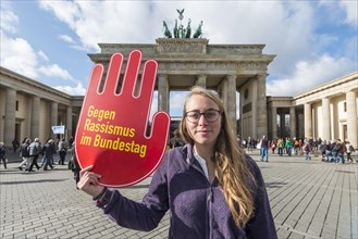 Student with shield against racism in the Bundestag