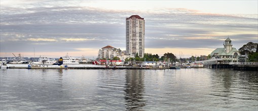 Panoramic view of Nanaimo city waterfront and harbour skyline on a summer evening during sunset
