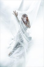 Redhead maiden woman in white cloth