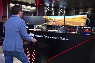 Visitors in front of a video game