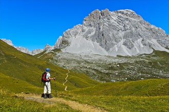 Hiker in front of the summit Sulzfluh