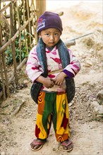 Little boy with inner tube of tire as toys around neck