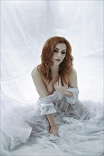 Redhead maiden woman in white cloth