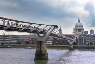 Millennium Bridge across the River Thames with St. Paul's Cathedral