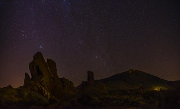 Roque Cinchado and Teide vulcano with starry sky