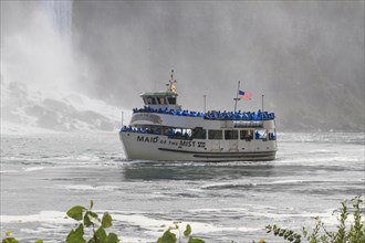 Tourist Boat Maid of the Mist in front of Waterfall